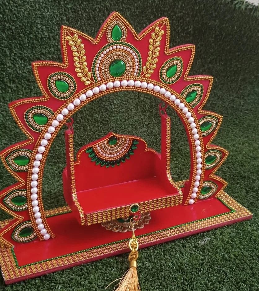 Ornate miniature temple singhasan jhula with arch design, pearl border and golden tassel